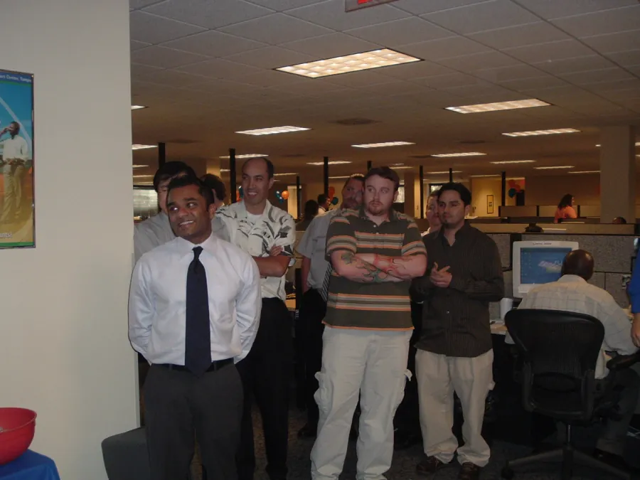 Scicom staff gathered on the Tampa contact centre floor