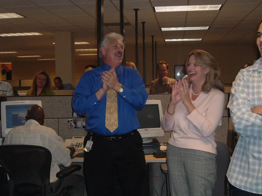 Tampa contact centre team members applauding during the opening